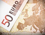 Macro image of two 50 Euro banknotes, with focus on the map of Europe.